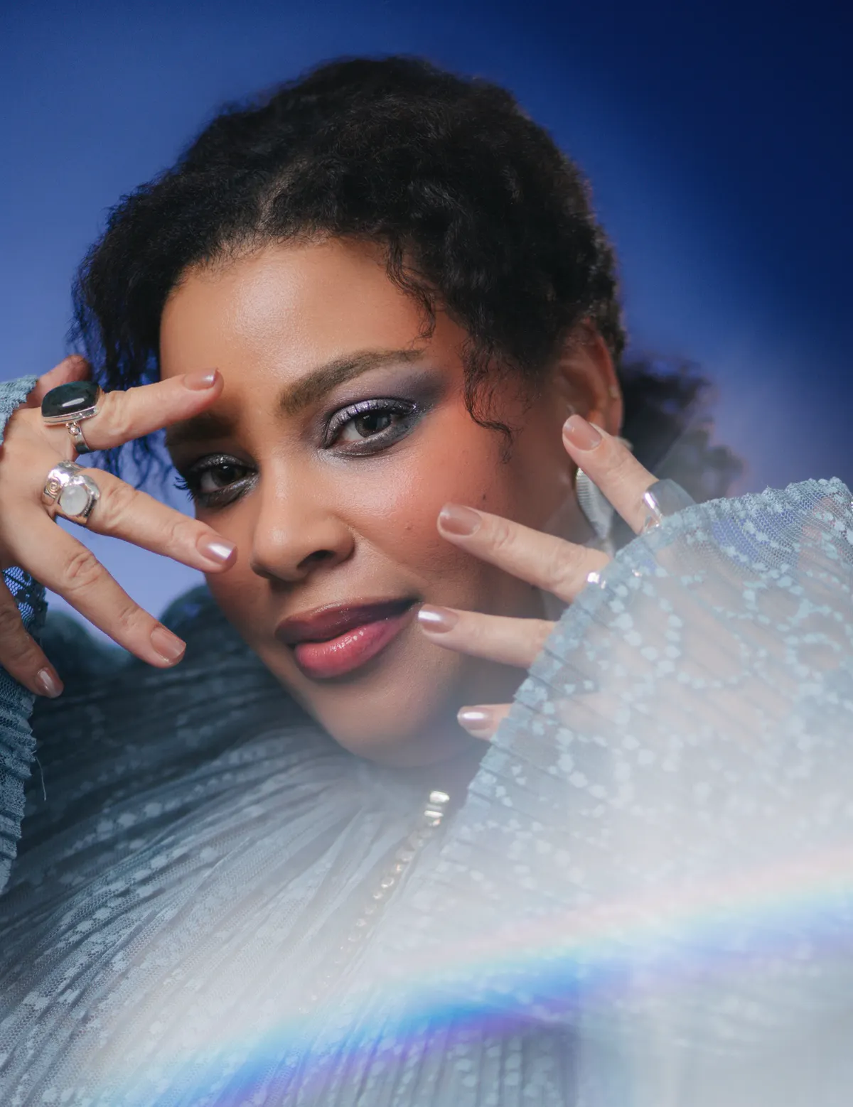 Portrait of Greivy® with expressive makeup and couture styling